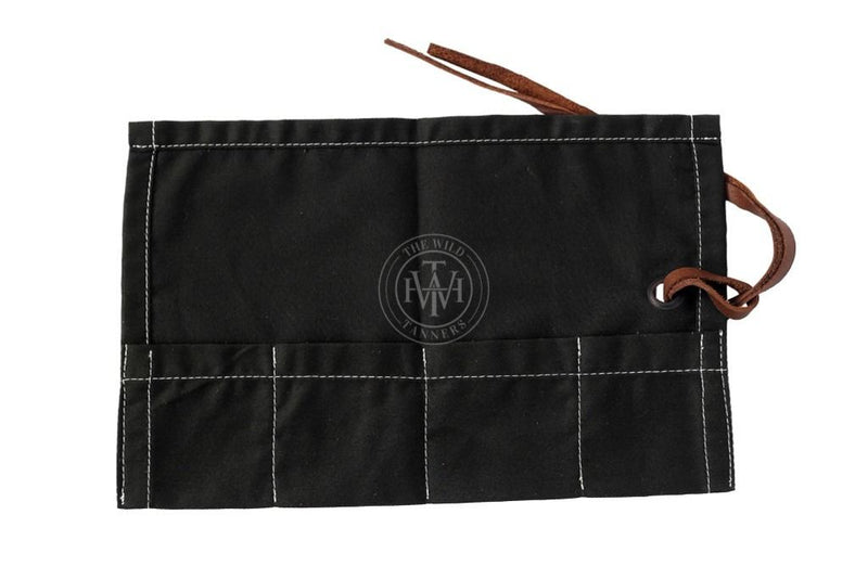 Black canvas tool roll, foldable storage pouch, roll-up tool bag, canvas utility roll, leather strap closure pouch, compact tool organizer, handmade tool holder, artisan tool wrap, canvas pouch with leather tie, heavy-duty canvas tool roll, cotton canvas storage case, durable fabric tool organizer, multi-pocket tool roll, portable tool wrap, hand tool storage pouch, tool kit roll for professionals, brush or tweezer roll case, minimalist tool pouch, rustic style tool roll, black pouch with white stitching,