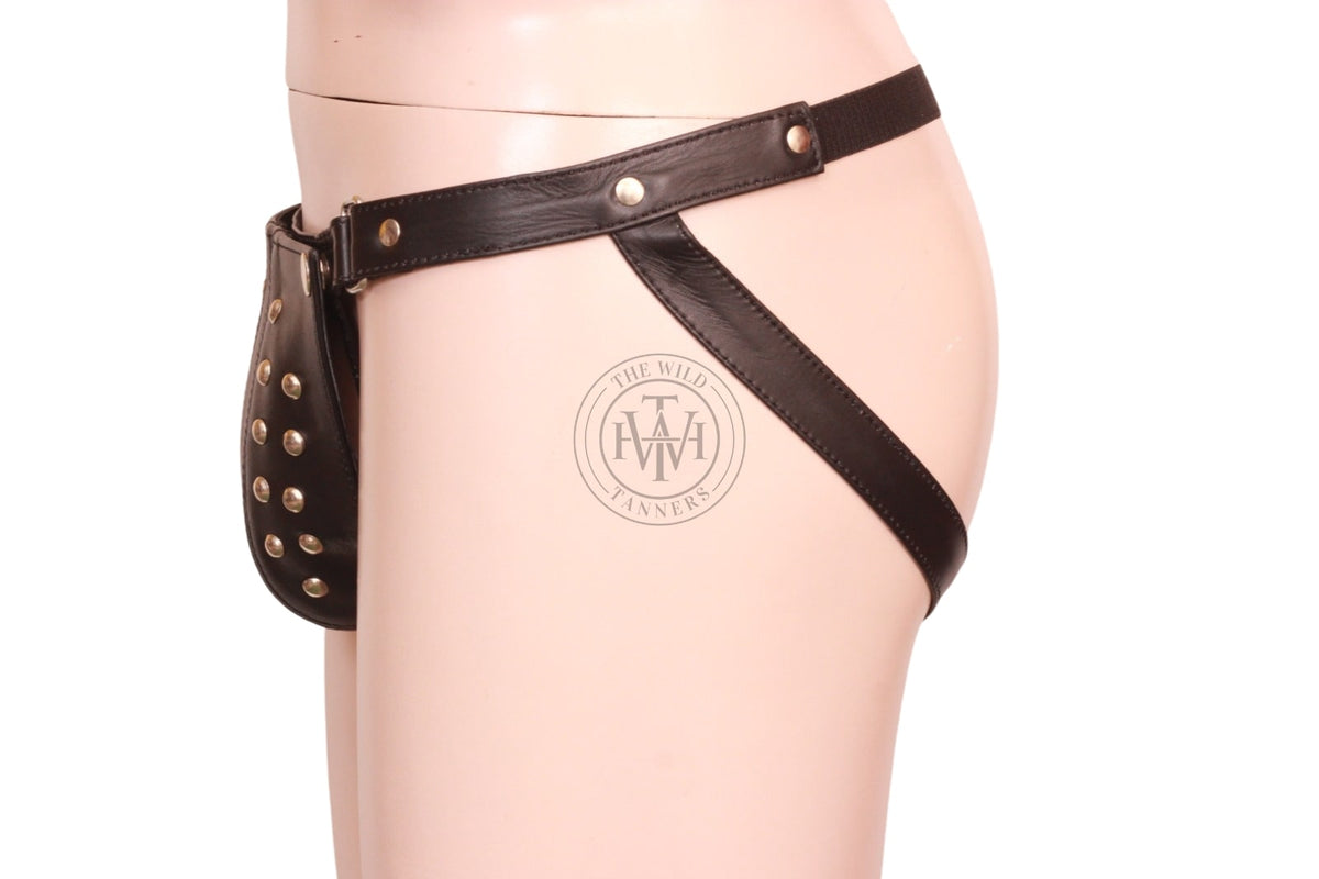 men's genuine leather thong, side view of black leather thong showing studded codpiece, hip ring and leather leg strap