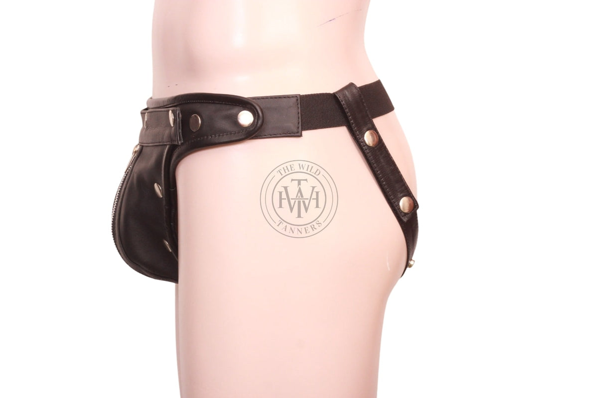 men's leather jockstrap with zipped cod piece, side view of black leather jockstrap showing zipped pouch, elastic back band and snap thigh strap