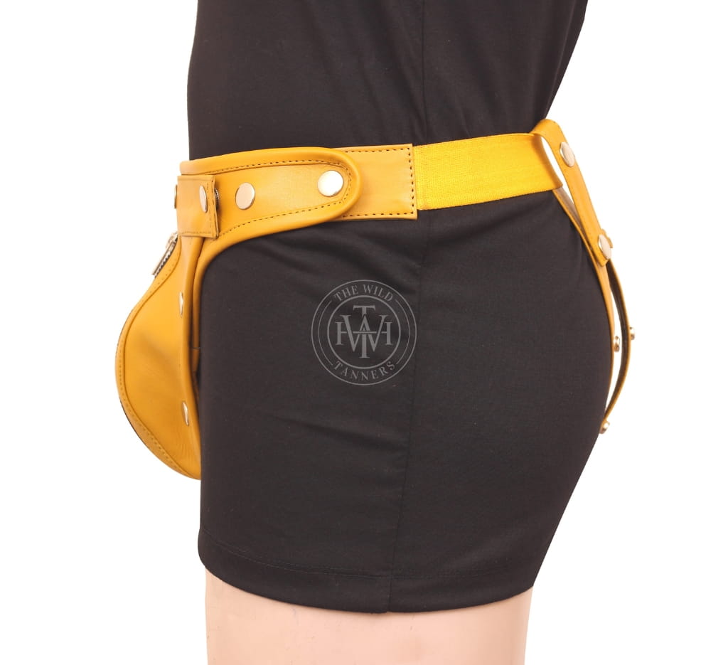 Yellow leather jockstrap, side view showing elastic back waistband and snap-button strap