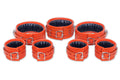 7-piece orange leather handcuffs set with adjustable straps and padded interiors