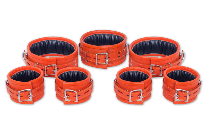 7-piece orange leather handcuffs set with adjustable straps and padded interiors
