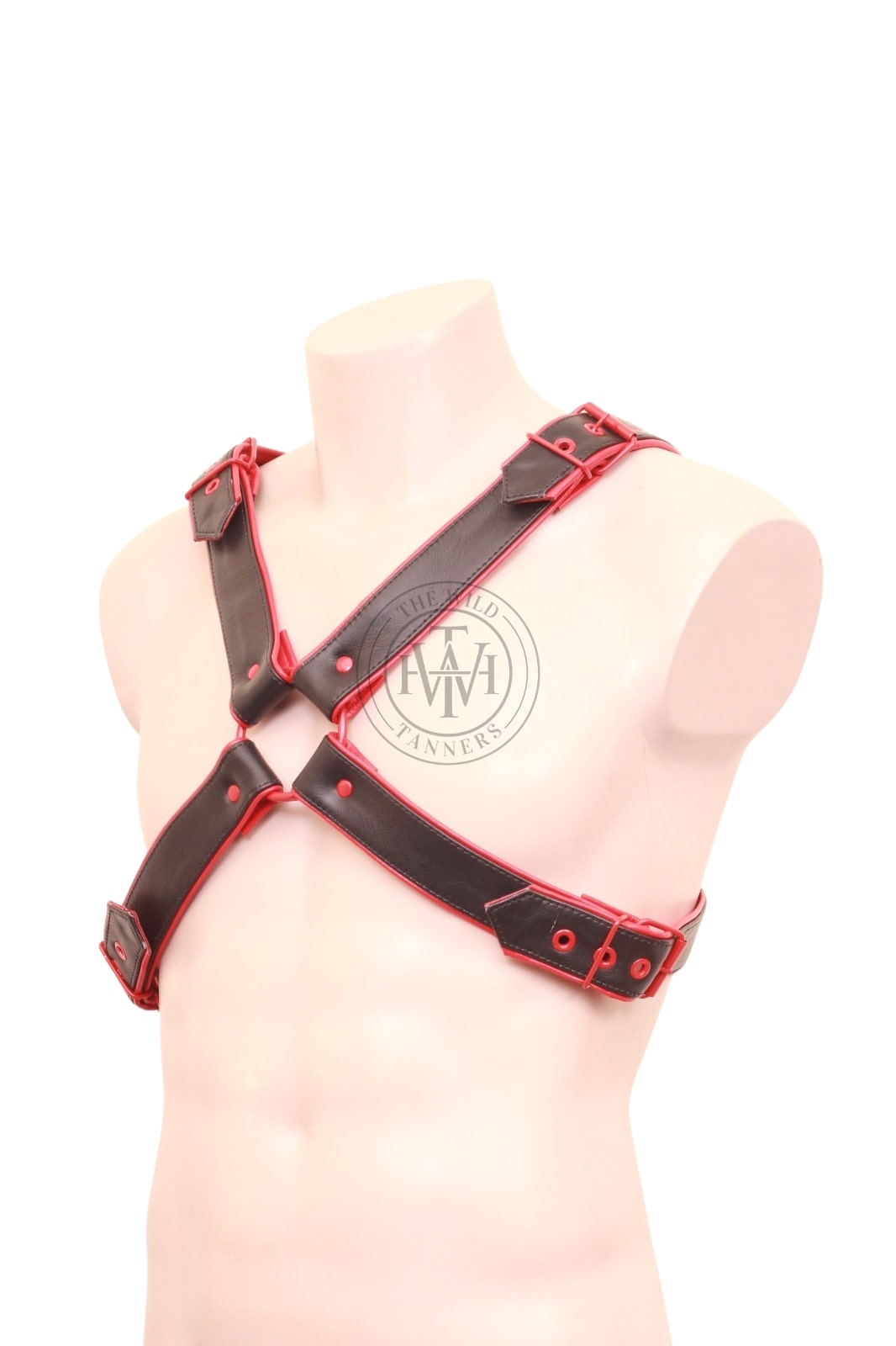 leather x harness styled with red studs and buckles
